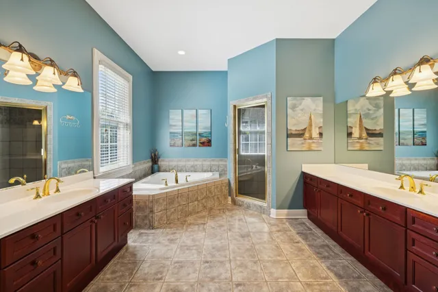 a spacious bedroom with a bed and a couch