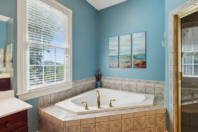 a bedroom with a bed and a table