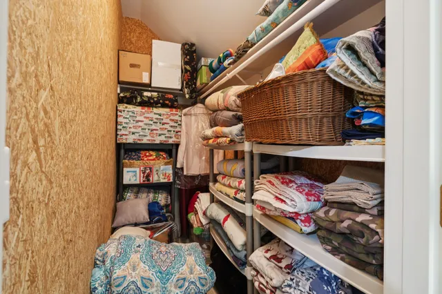 an aerial view of a house with a yard and lake view