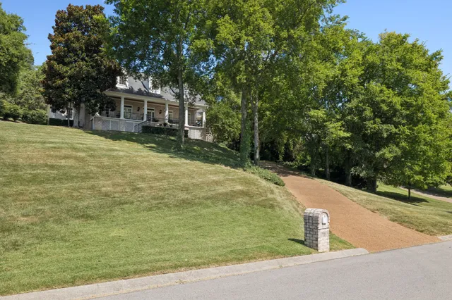 a view of balcony with wooden floor and outdoor seating