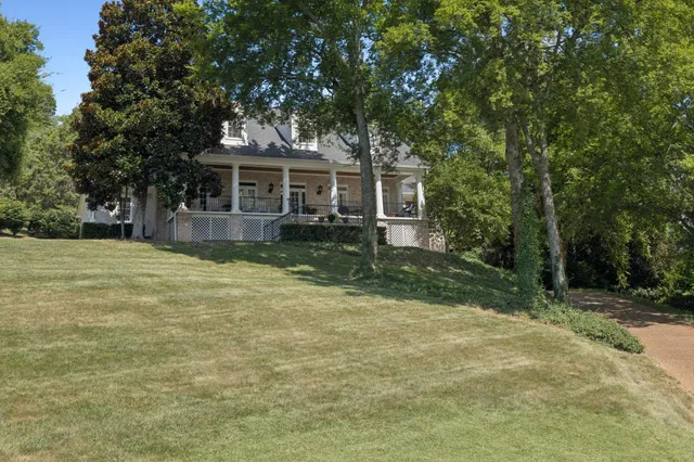 a view of an entryway with wooden floor and door