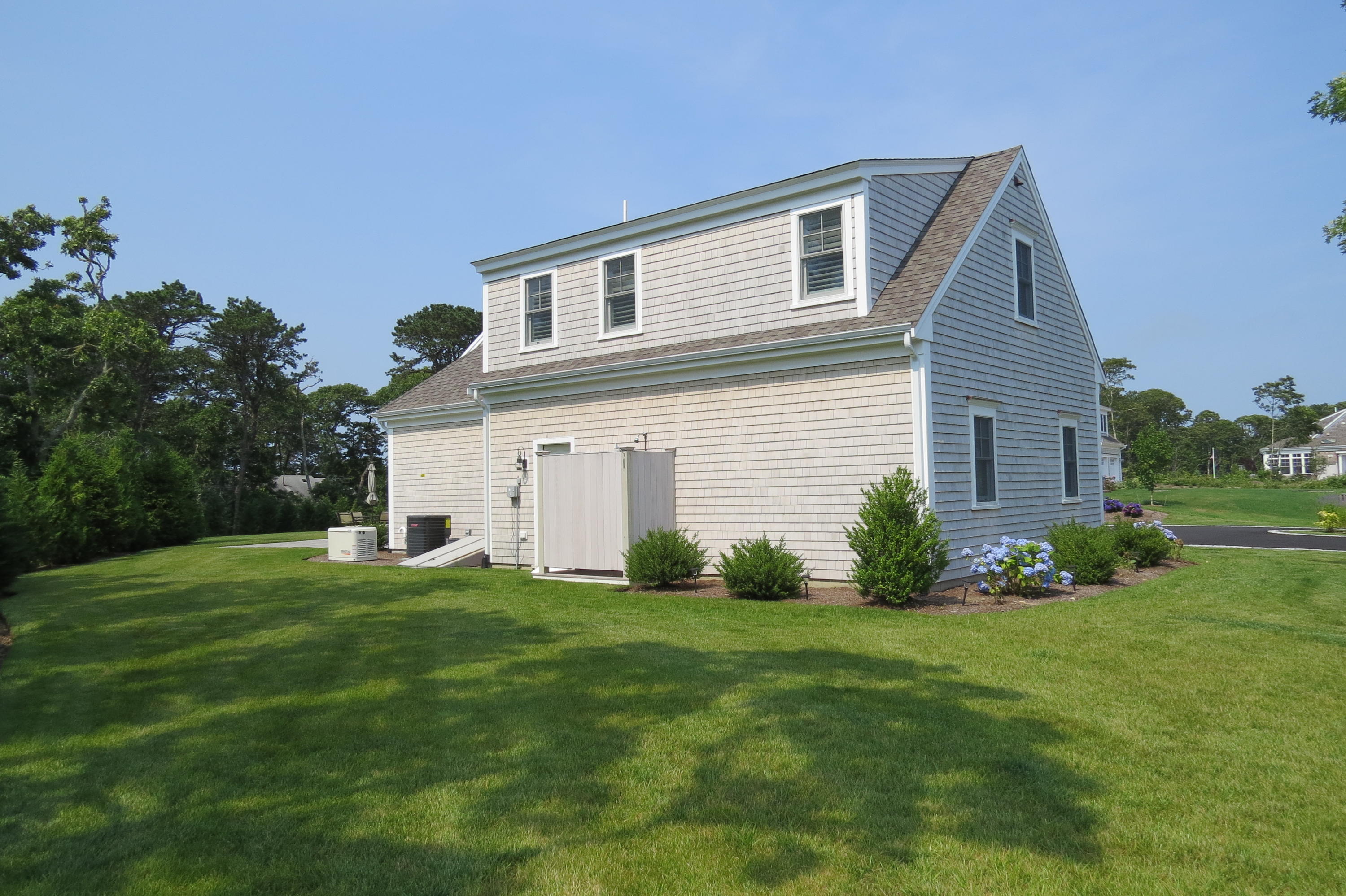 96 Hunter Rise Chatham, MA 02633 - Photo 23 of 37 a front view of house with yard and green space