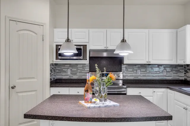 a living room with fireplace furniture and a wooden floor
