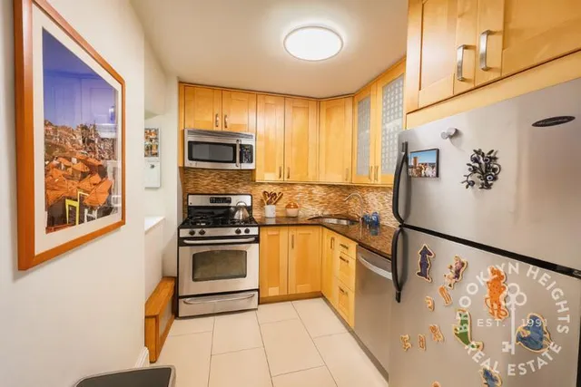 a living room with furniture a window and a chandelier
