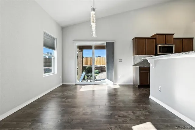a view of a livingroom with an empty space and a window