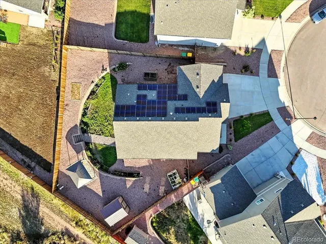 an aerial view of a house with outdoor space