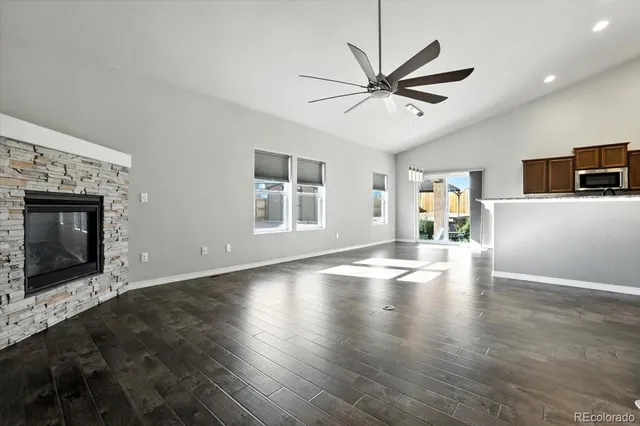 a view of livingroom with hardwood floor and a ceiling fan