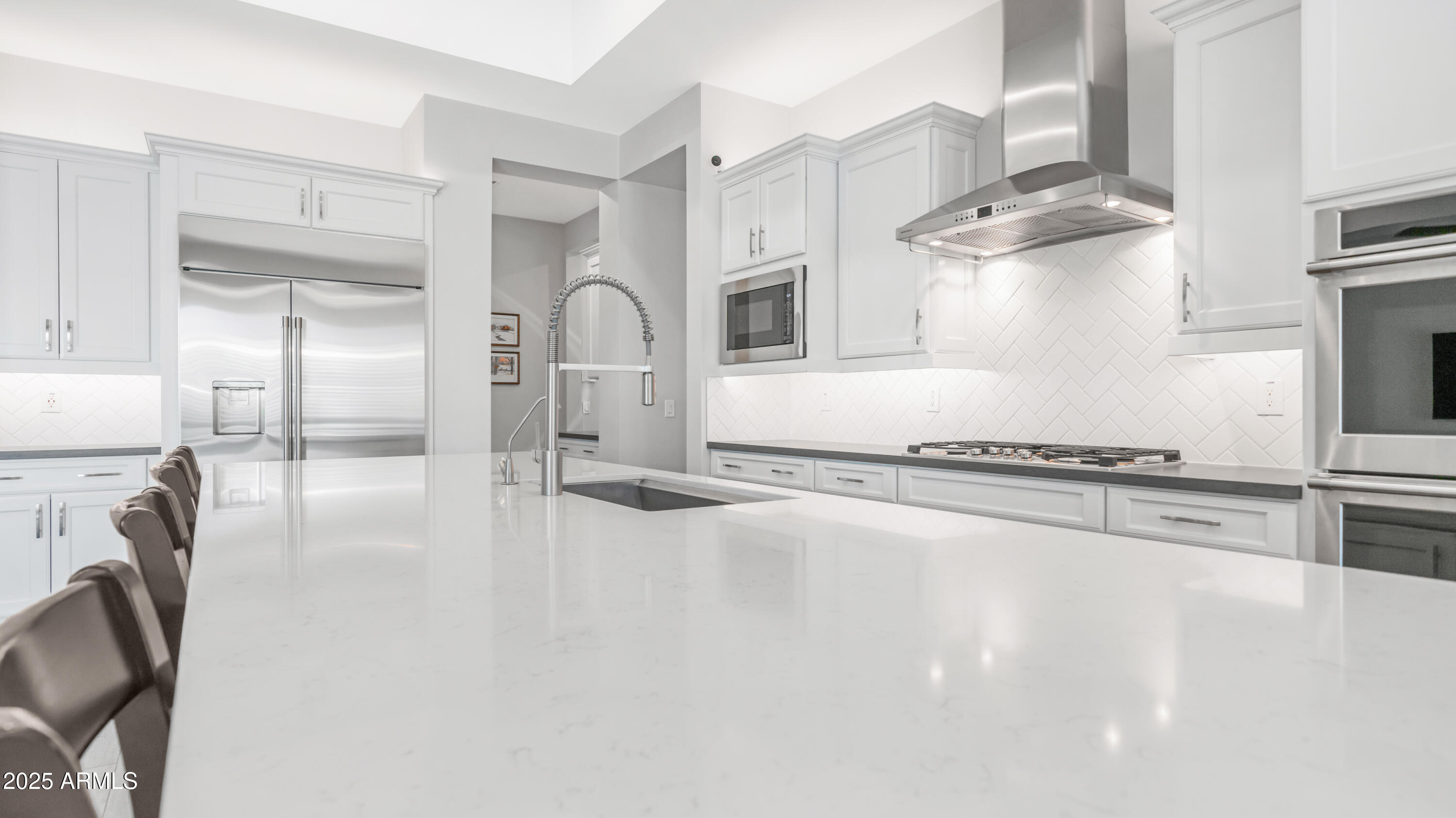 2086 East Trigger Way Gilbert, AZ 85297 - Photo 48 of 69 a kitchen with stainless steel appliances granite countertop a stove a sink and a refrigerator