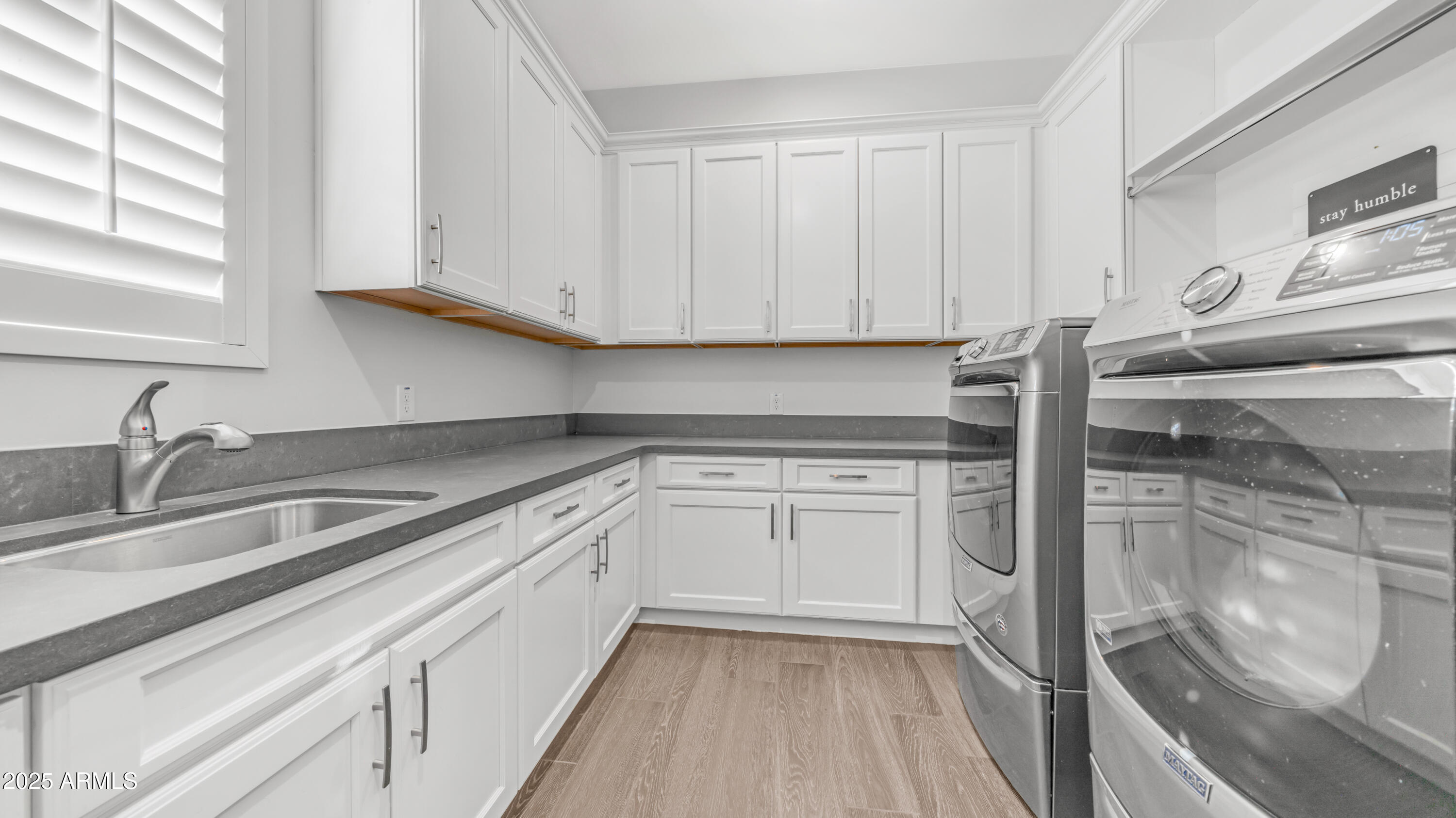 2086 East Trigger Way Gilbert, AZ 85297 - Photo 50 of 69 a kitchen with a sink and cabinets