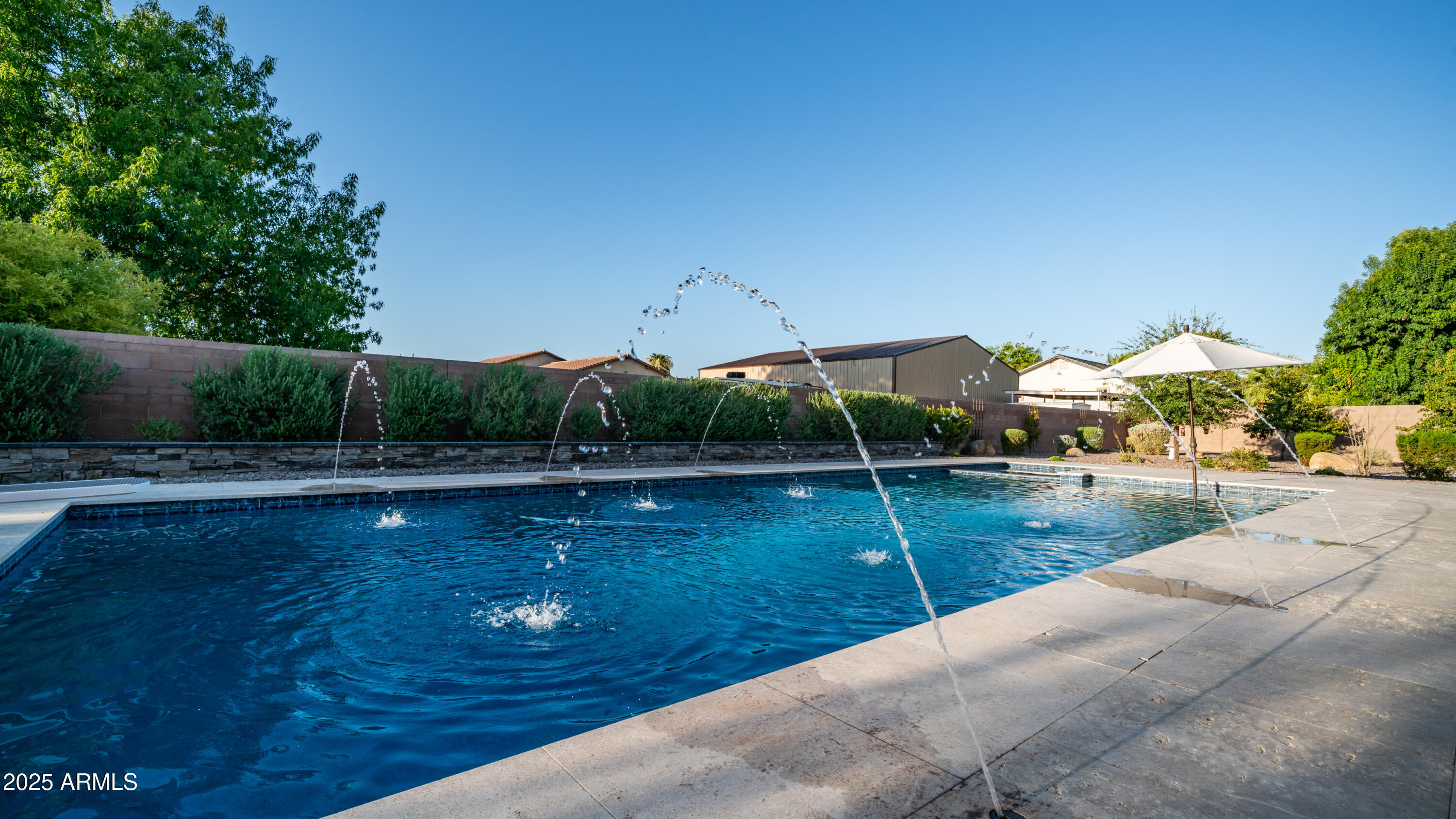 2086 East Trigger Way Gilbert, AZ 85297 - Photo 58 of 69 a view of a swimming pool and lounge chairs