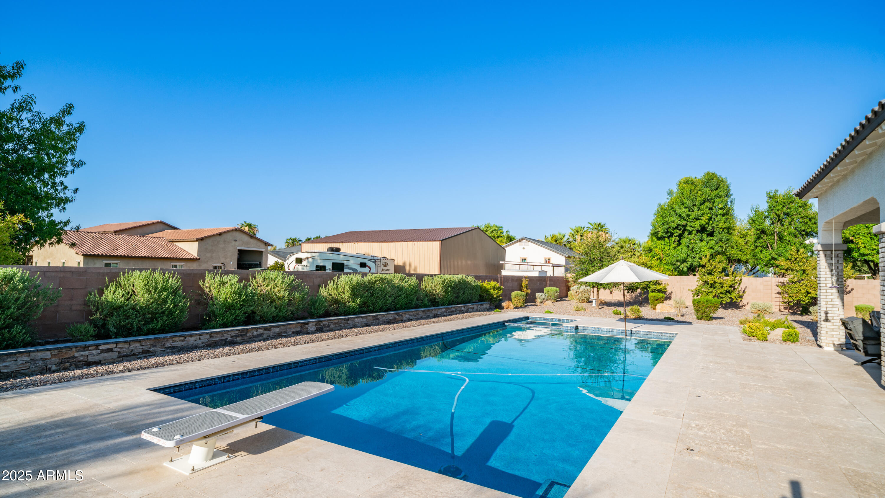 2086 East Trigger Way Gilbert, AZ 85297 - Photo 67 of 69 a view of a swimming pool with a patio