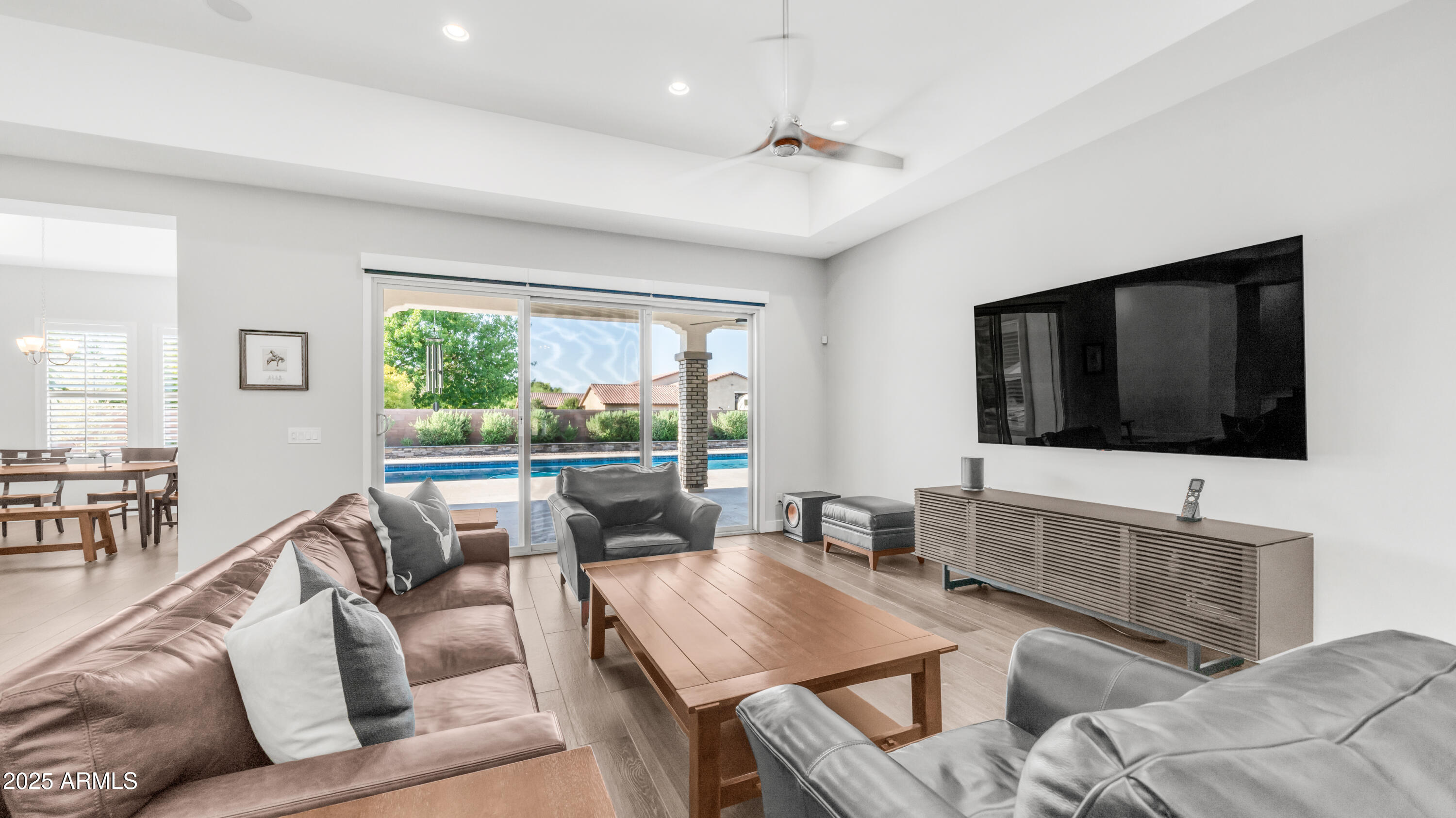 2086 East Trigger Way Gilbert, AZ 85297 - Photo 7 of 69 a living room with furniture a flat screen tv and a large window