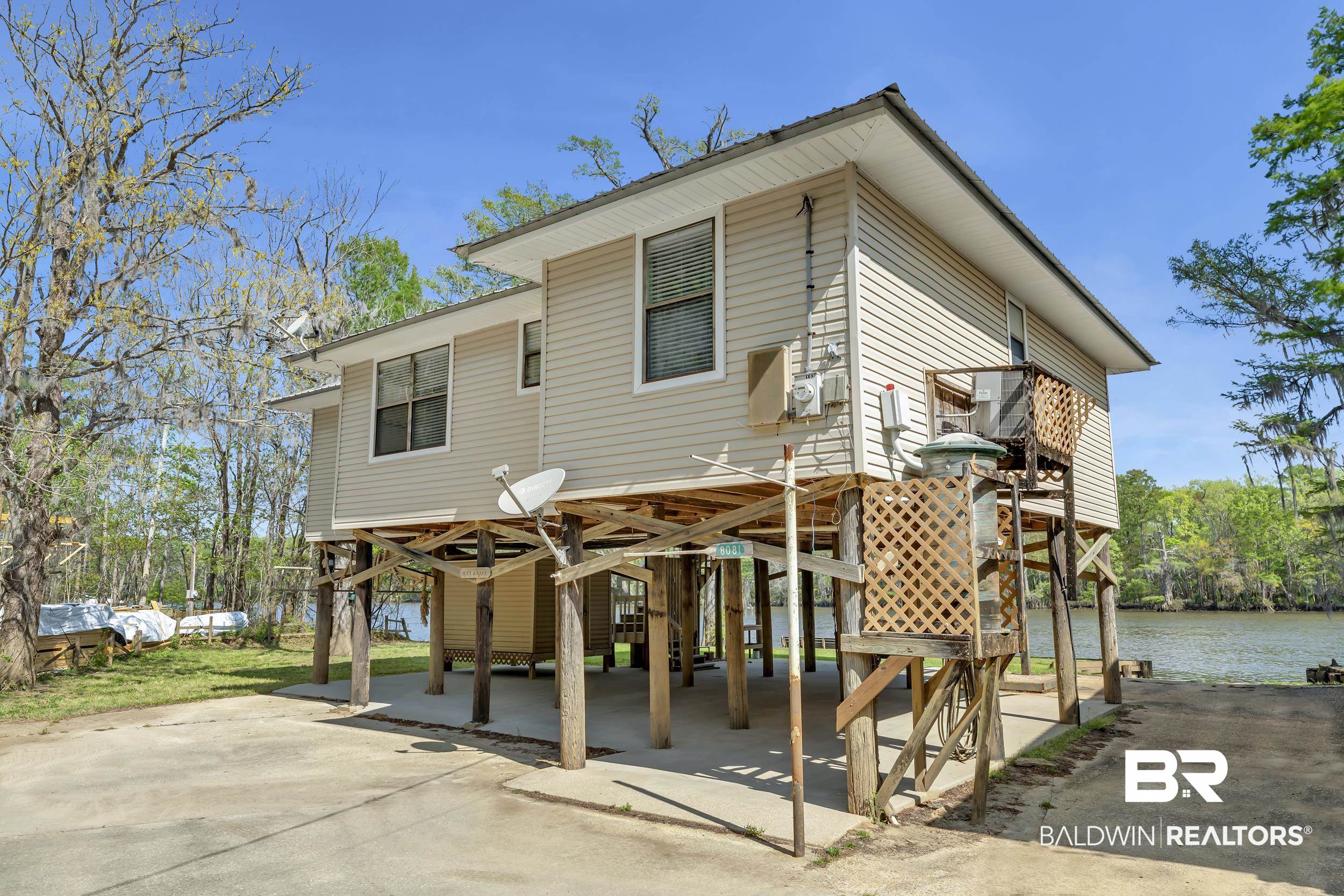 8081 Bryant's Lndg Road Stockton, AL 36579 - Photo 11 of 48 Rear view of house featuring a carport