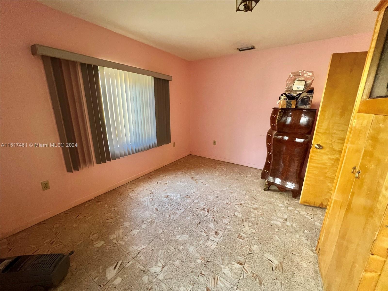 2675 Southwest 24th Terrace Miami, FL 33145 - Photo 12 of 17 an empty room with windows