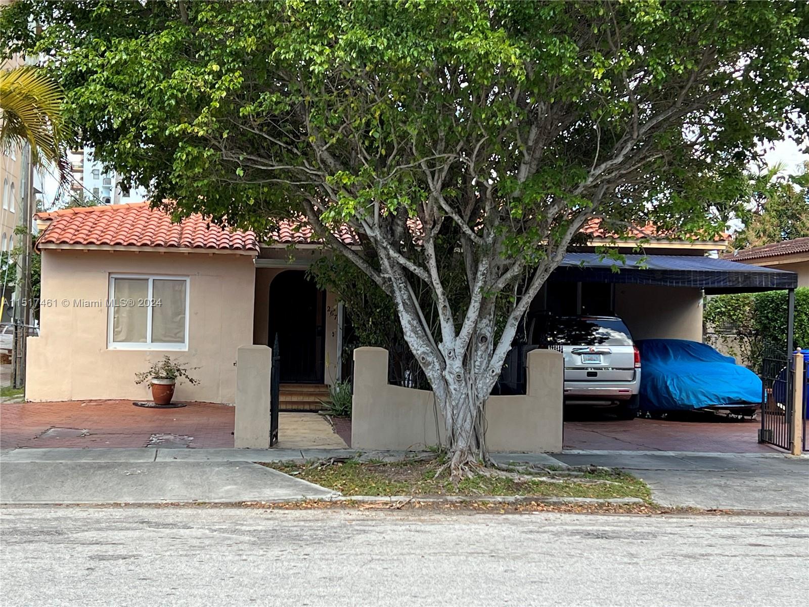 2675 Southwest 24th Terrace Miami, FL 33145 - Photo 2 of 17 a front view of a house with garden