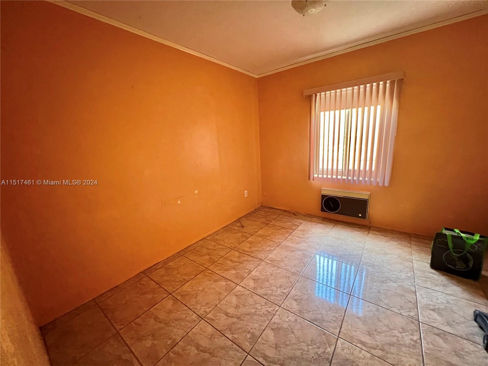2675 Southwest 24th Terrace Miami, FL 33145 - Photo 9 of 17 a view of an empty room with a window