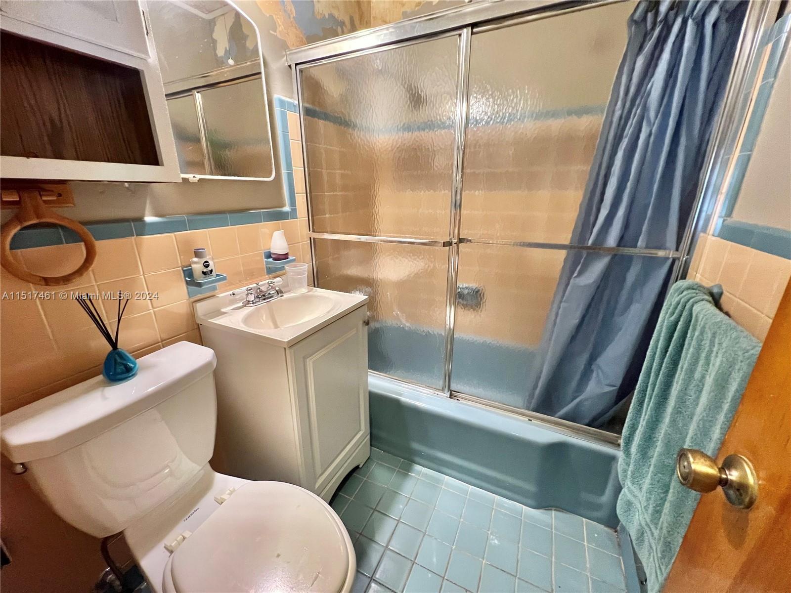 2675 Southwest 24th Terrace Miami, FL 33145 - Photo 10 of 17 a bathroom with a sink a toilet and shower