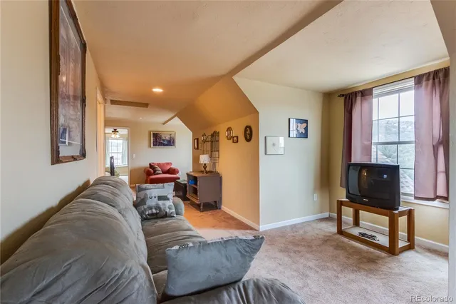 a living room with furniture and a couch