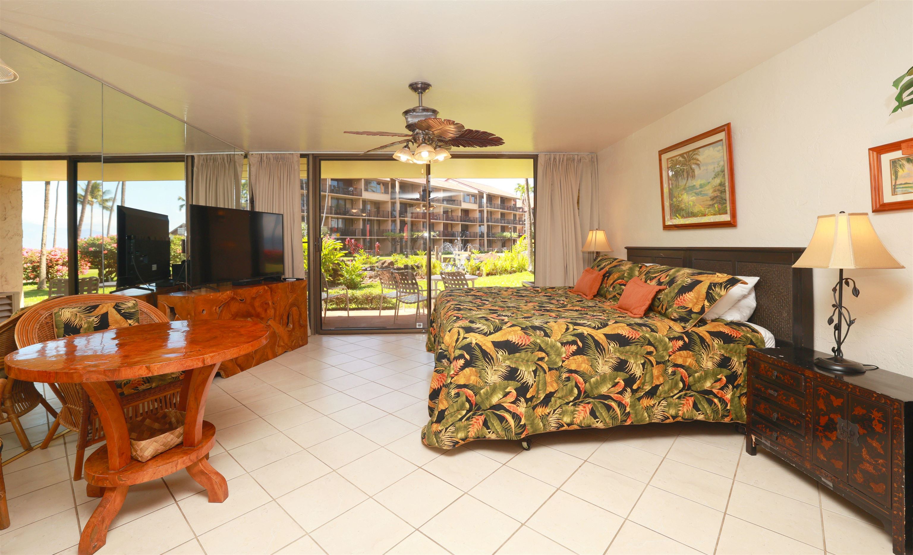 3543 Lower Honoapiilani Road, Unit C107 Lahaina, HI 96761 - Photo 18 of 49 a bed room with a bed and a flat screen tv