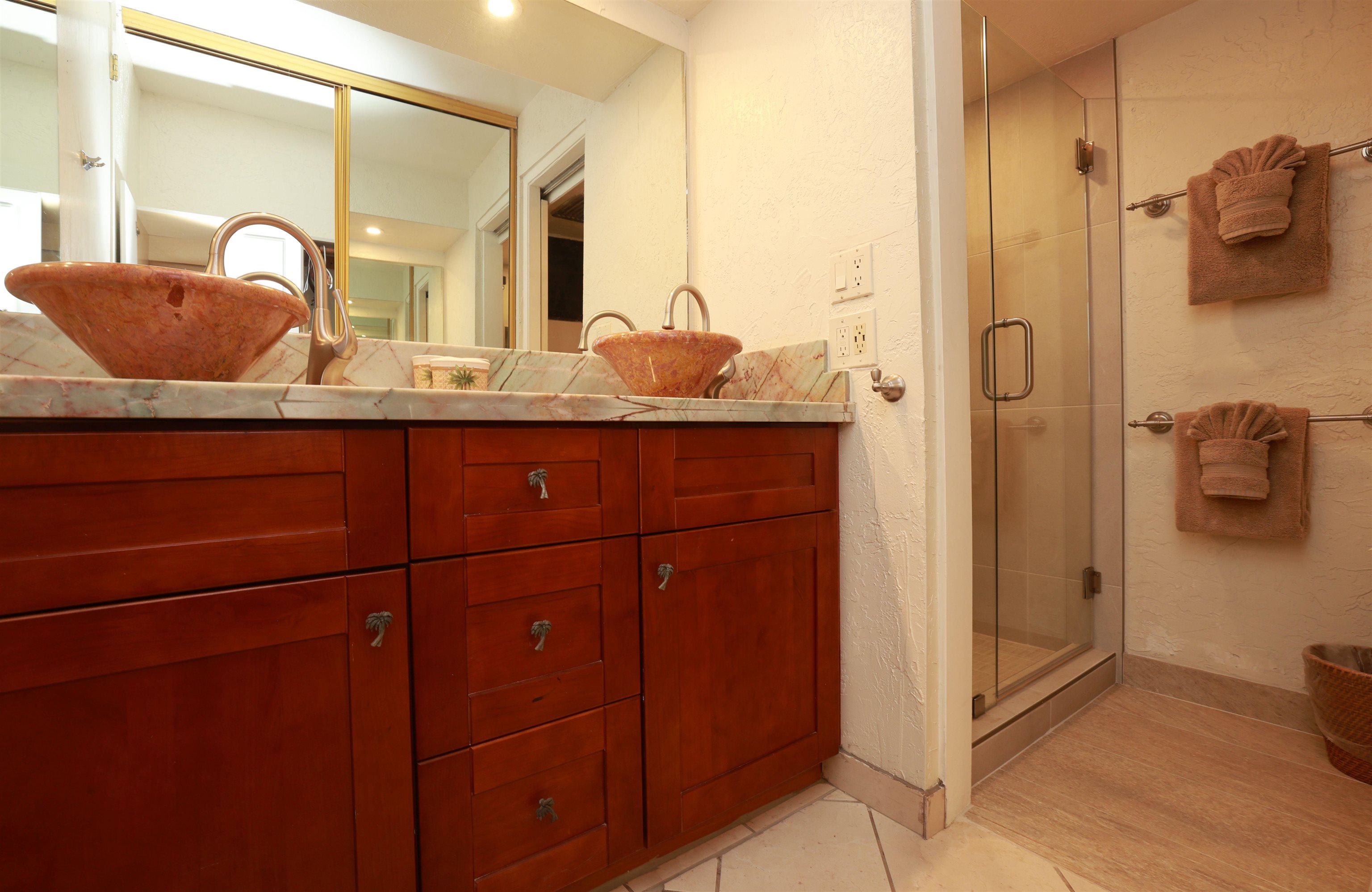 3543 Lower Honoapiilani Road, Unit C107 Lahaina, HI 96761 - Photo 29 of 49 a bathroom with a granite countertop sink and a mirror