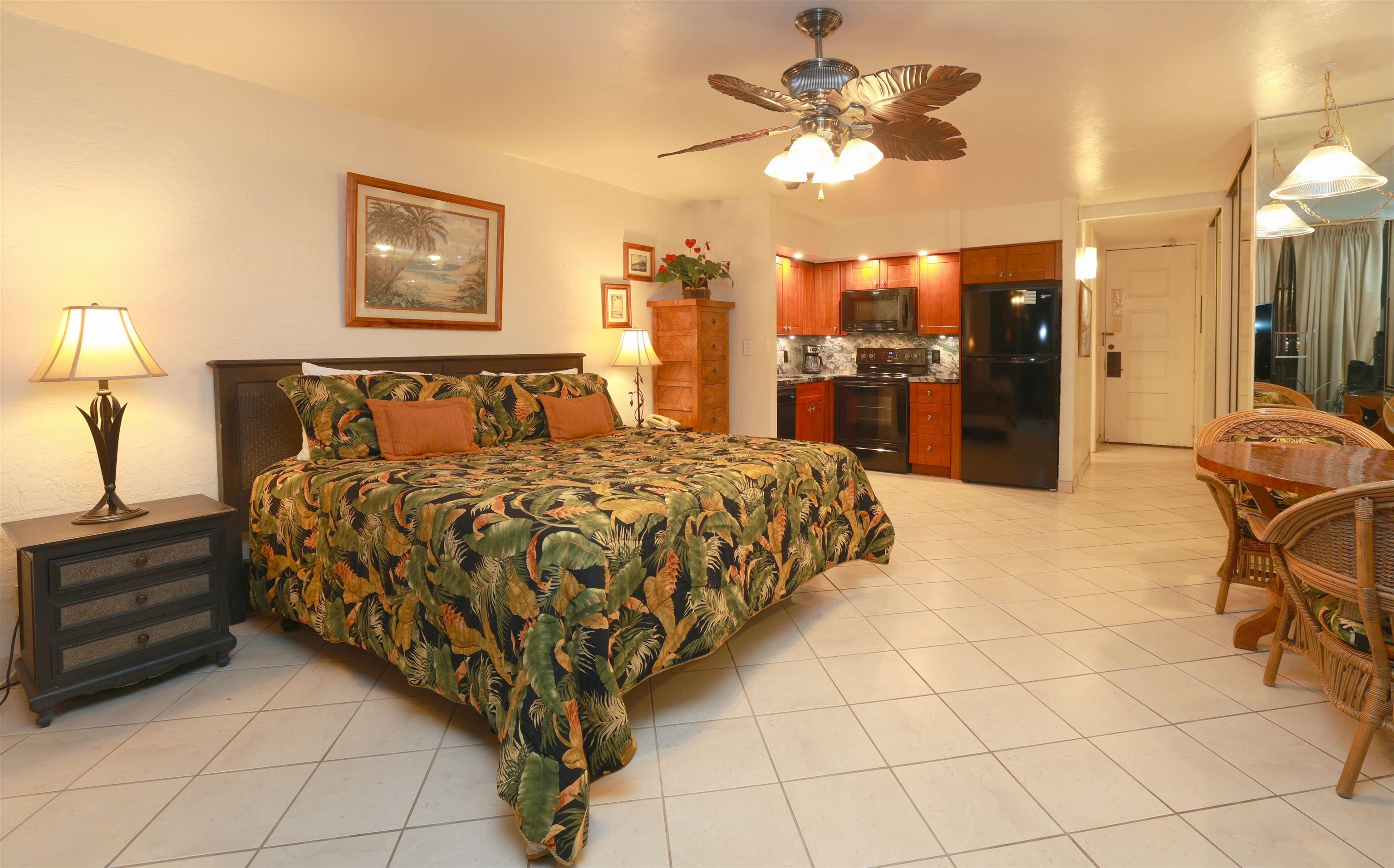 3543 Lower Honoapiilani Road, Unit C107 Lahaina, HI 96761 - Photo 6 of 49 a bed room with a bed and a chandelier