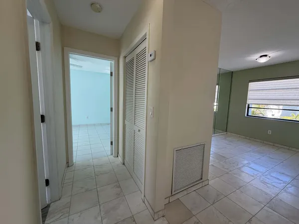 a view of an empty room and window