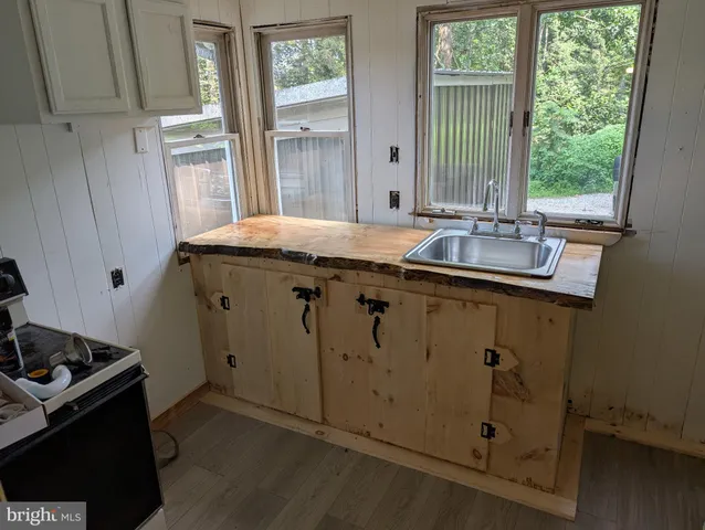 a kitchen with a sink and a window