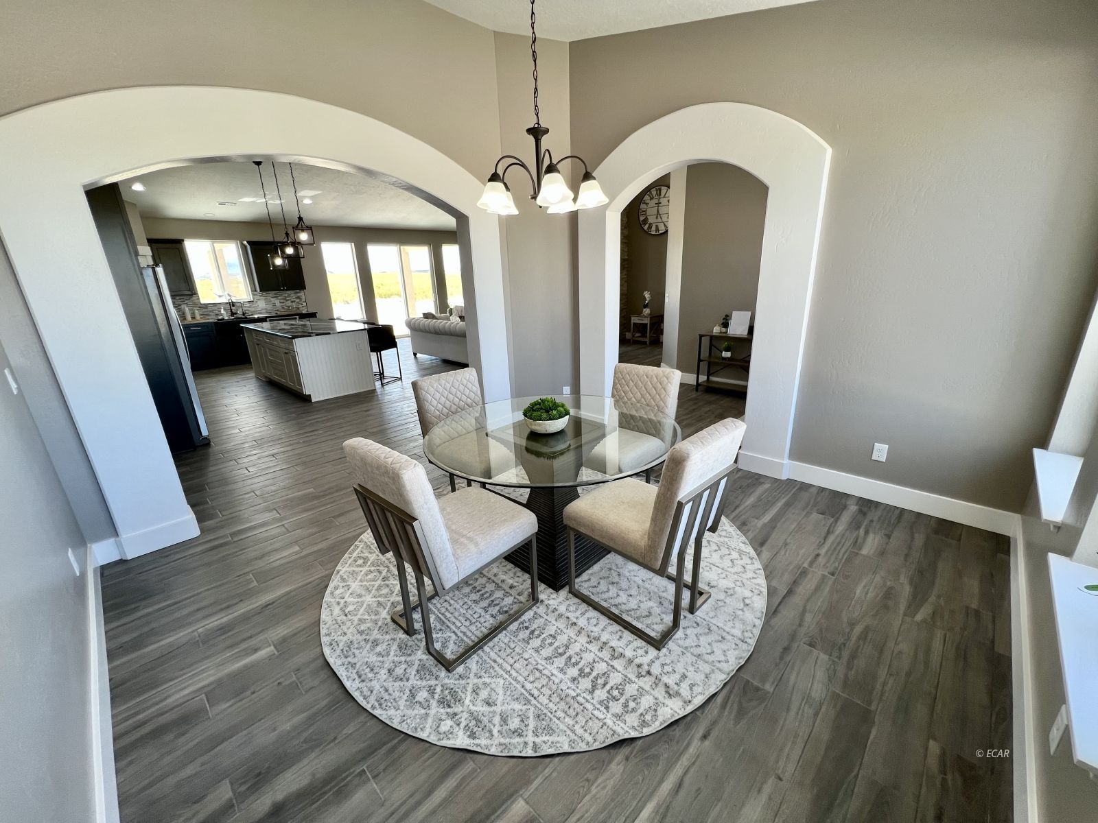 298 Ridgeway Drive Spring Creek, NV 89815 - Photo 11 of 45 a view of a dining room with furniture chandelier and wooden floor