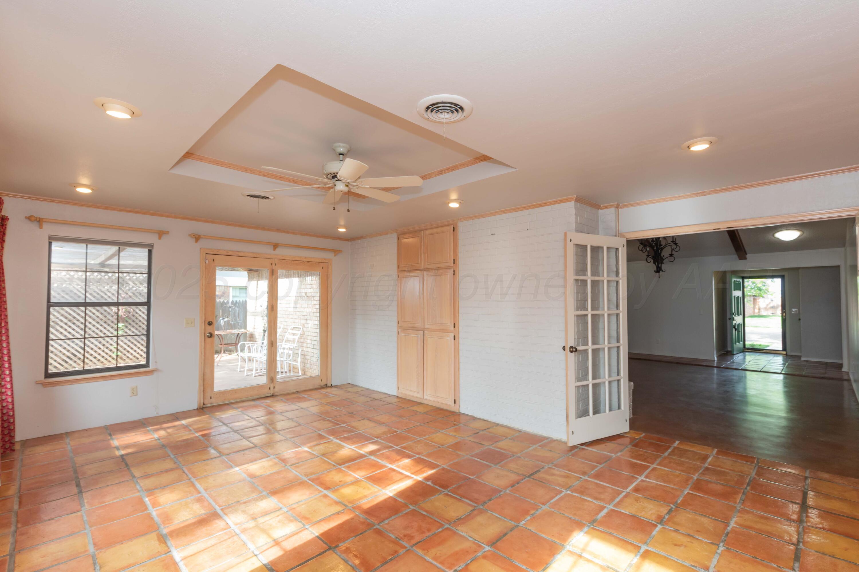 1031 Cimarron Trail Canyon, TX 79015 - Photo 12 of 50 a view of an empty room with window and wooden floor