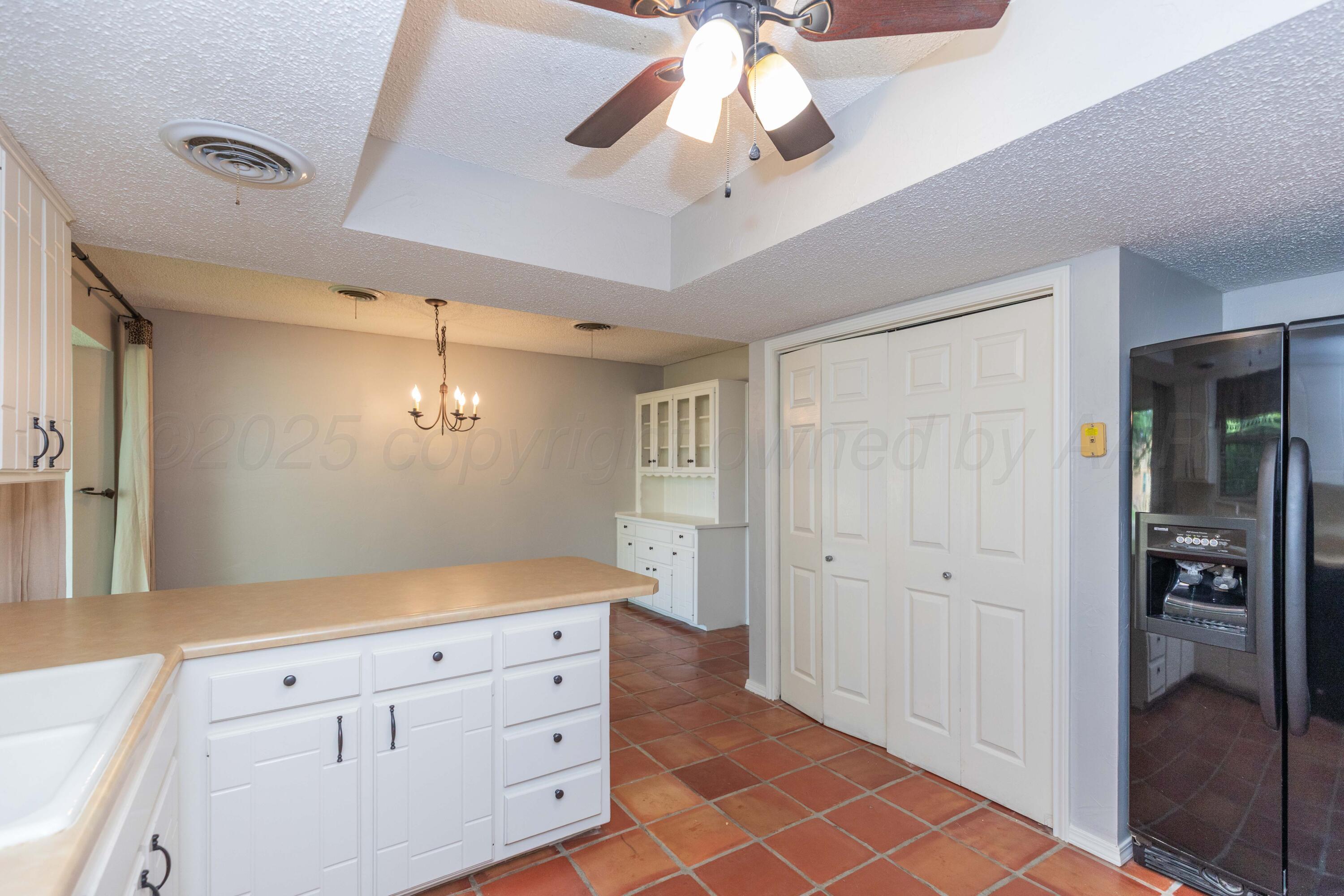1031 Cimarron Trail Canyon, TX 79015 - Photo 16 of 50 a view of a hallway to closet and wooden floor