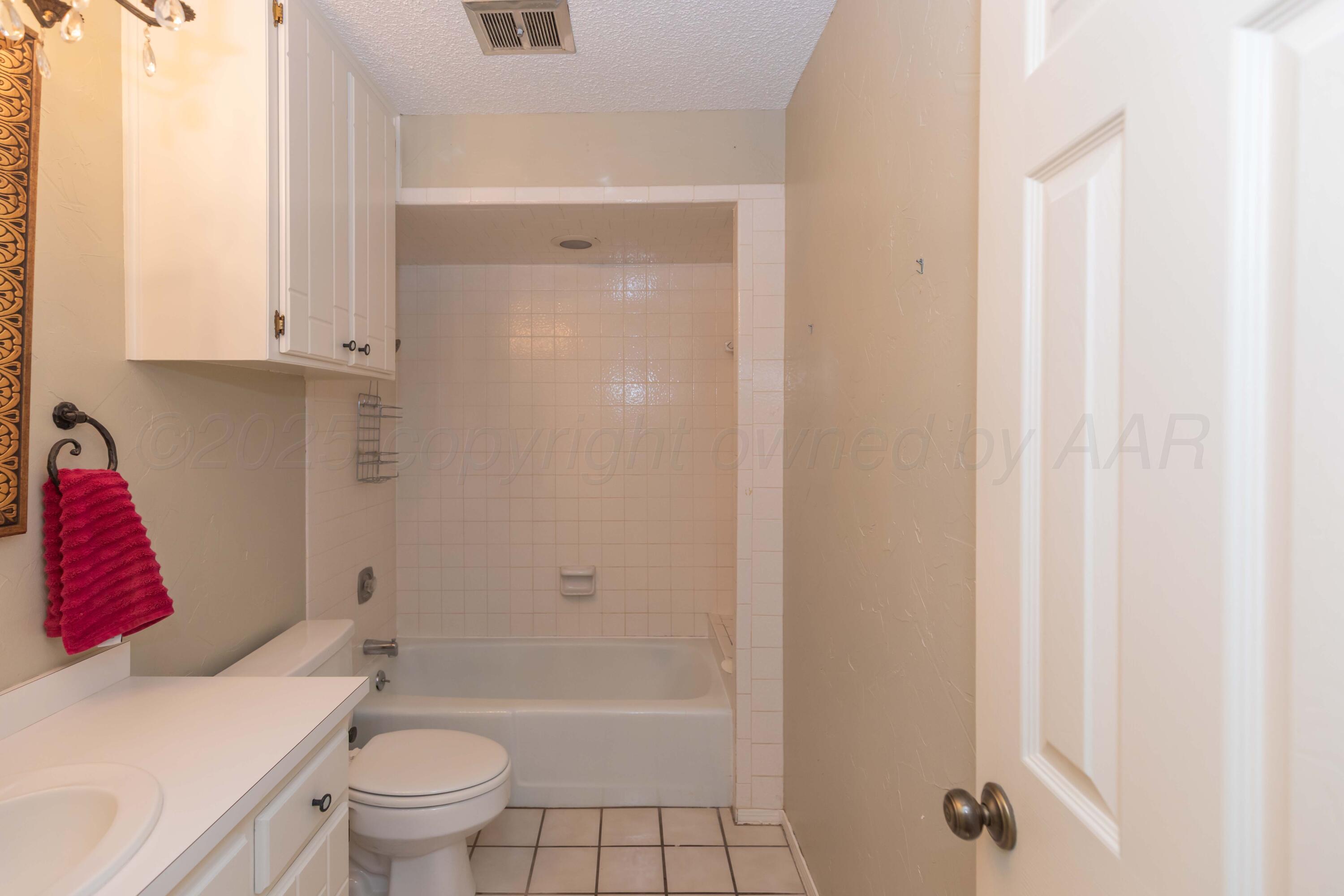 1031 Cimarron Trail Canyon, TX 79015 - Photo 29 of 50 a bathroom with a toilet and shower