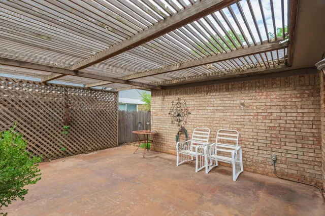 a balcony with chairs and table