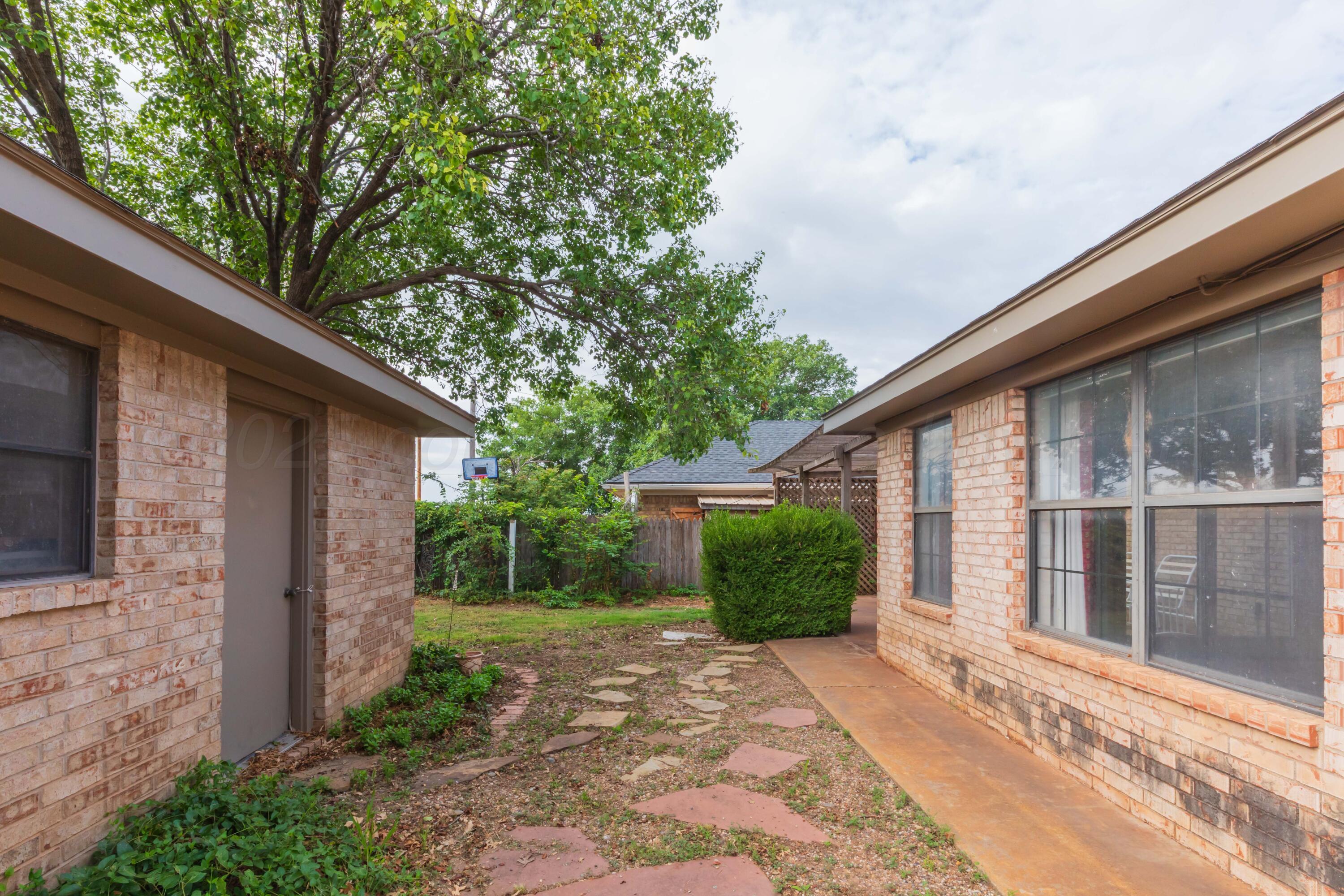 1031 Cimarron Trail Canyon, TX 79015 - Photo 47 of 50 a view of a house with a yard