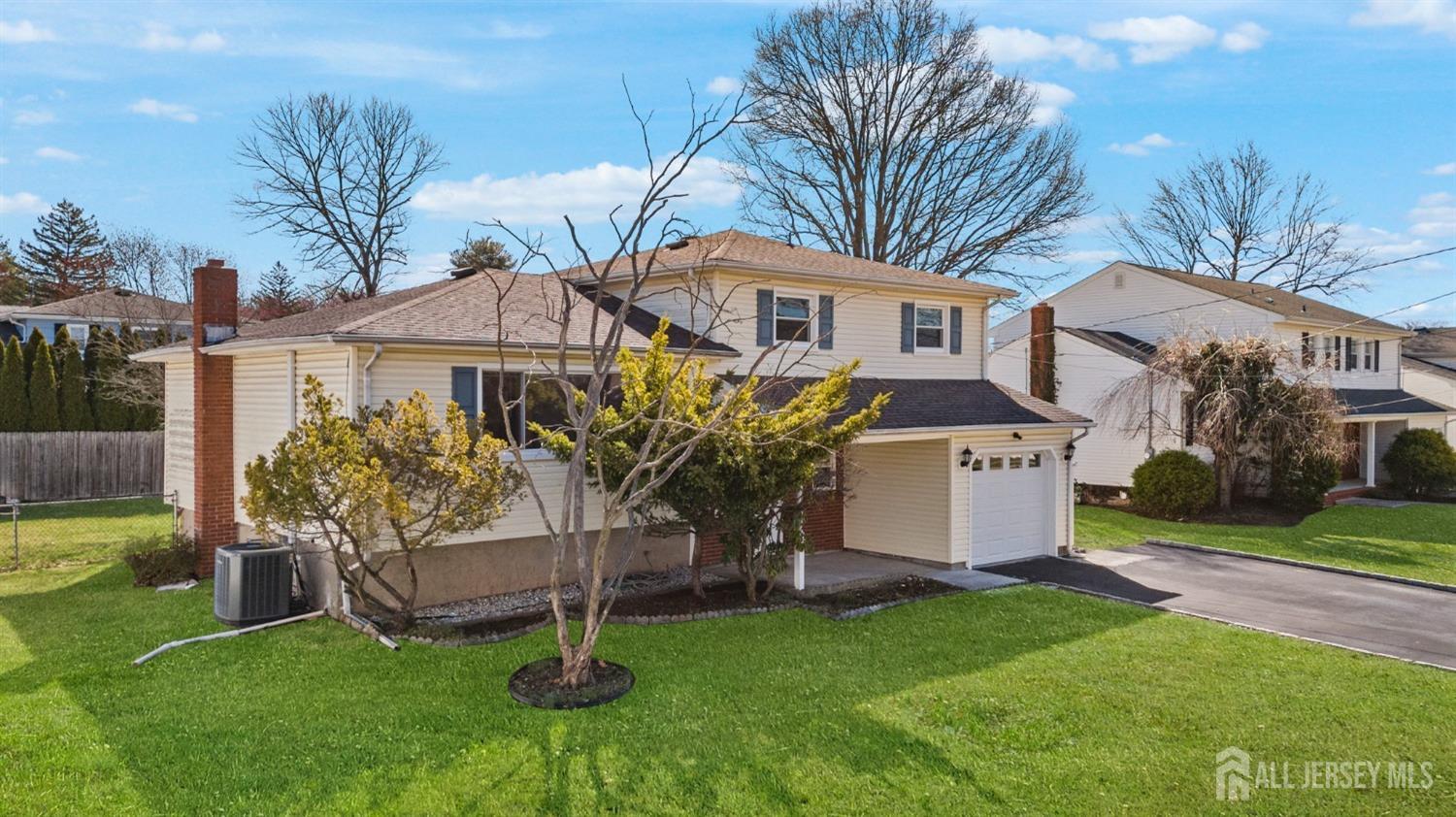 24 Lench Avenue Edison, NJ 08820 - Photo 2 of 38 a front view of a house with garden