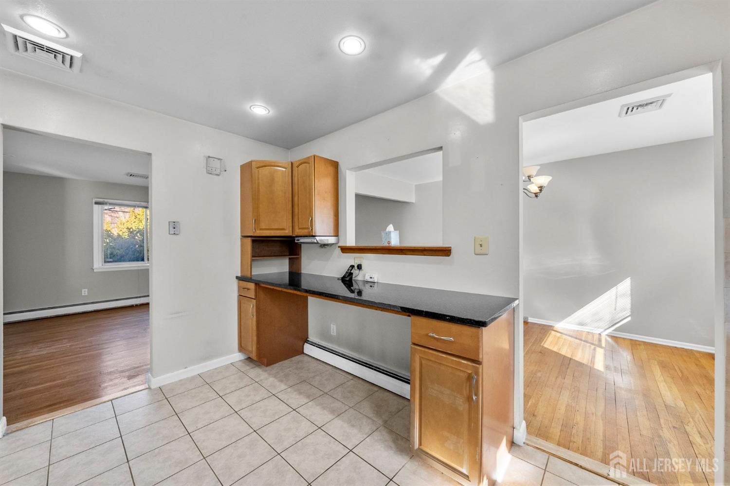 24 Lench Avenue Edison, NJ 08820 - Photo 22 of 38 a kitchen with granite countertop a sink and a stove