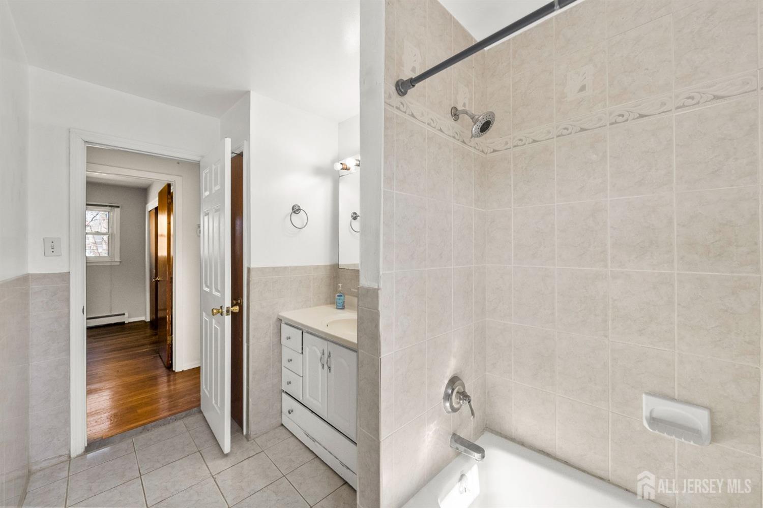 24 Lench Avenue Edison, NJ 08820 - Photo 26 of 38 a spacious bathroom with a shower and a sink