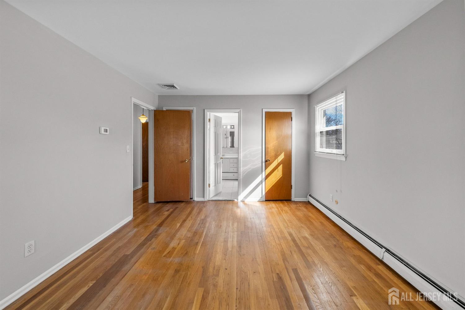 24 Lench Avenue Edison, NJ 08820 - Photo 29 of 38 a view of wooden floor in an empty room
