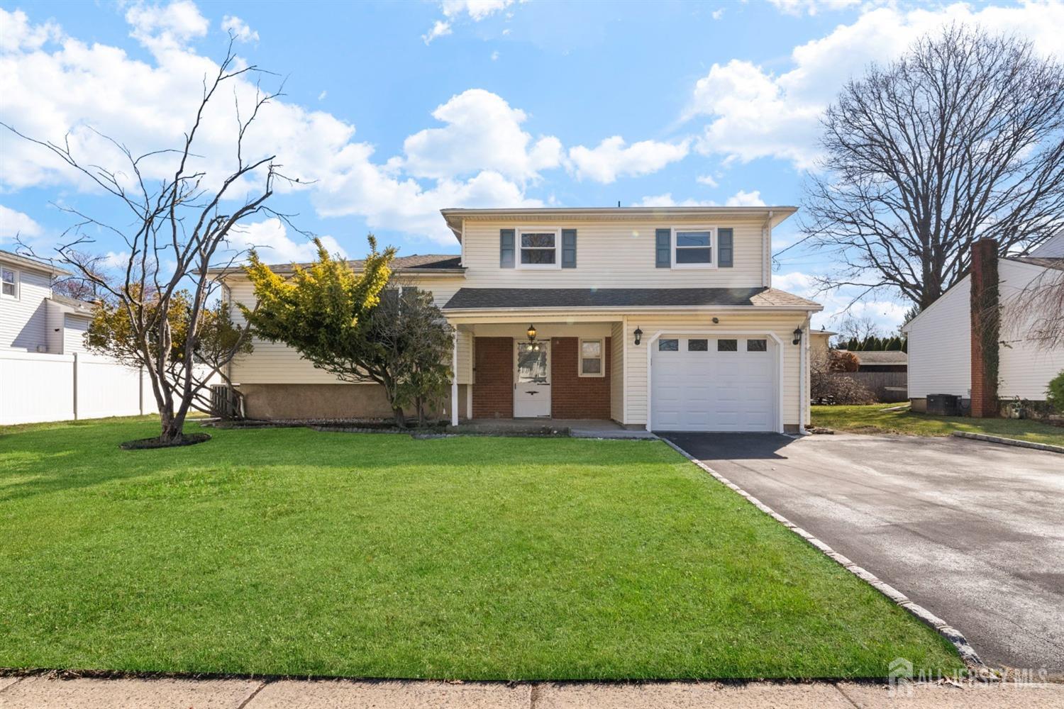 24 Lench Avenue Edison, NJ 08820 - Photo 36 of 38 a view of a yard in front of a house
