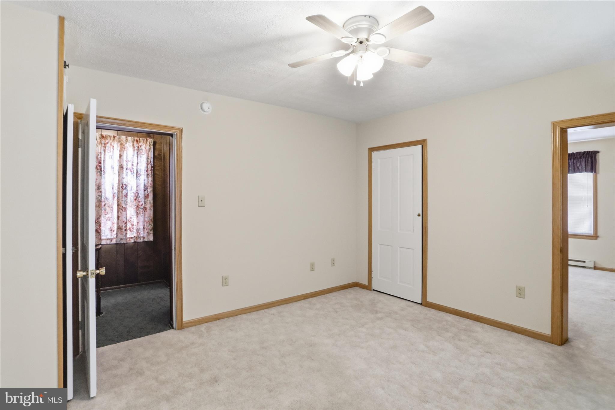 438 Chestnut Street Cumberland, MD 21502 - Photo 13 of 36 an empty room with windows and fan
