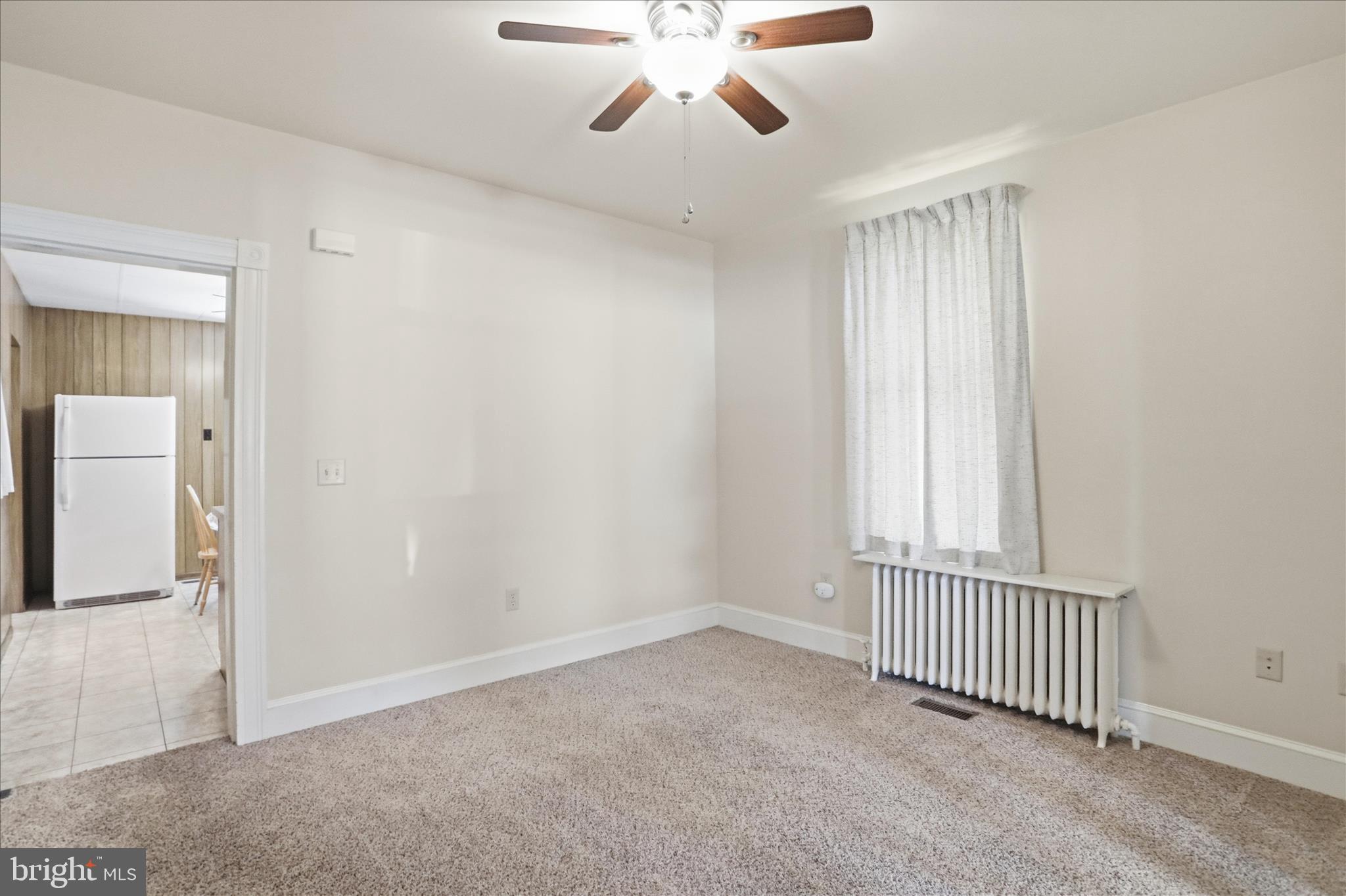 438 Chestnut Street Cumberland, MD 21502 - Photo 20 of 36 a view of a livingroom with a ceiling fan and window