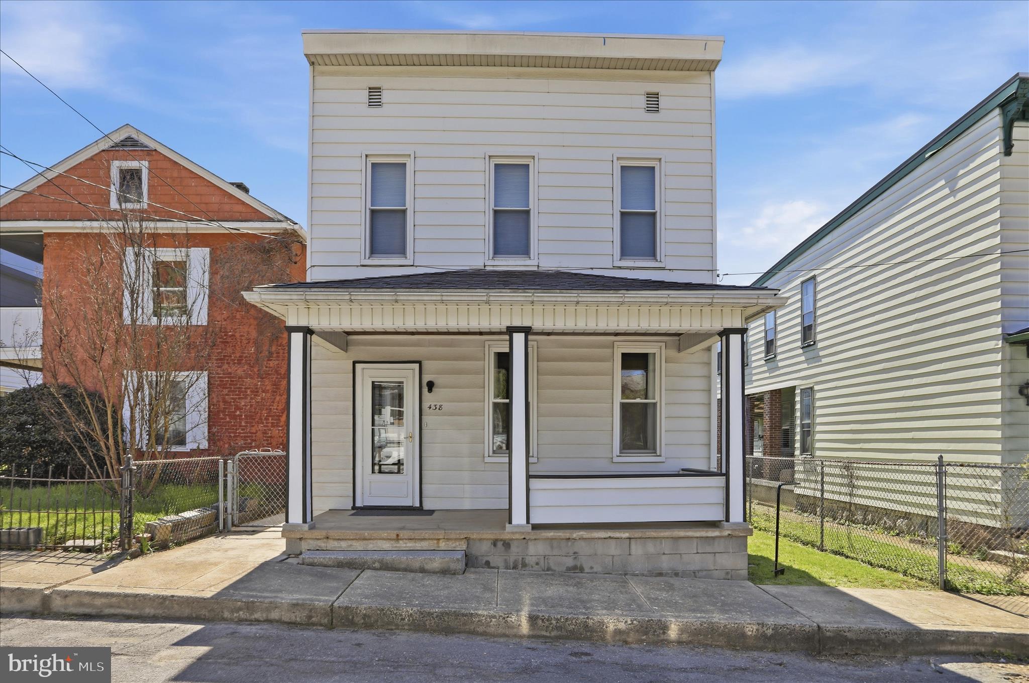 438 Chestnut Street Cumberland, MD 21502 - Photo 2 of 36 a front view of a house with garden