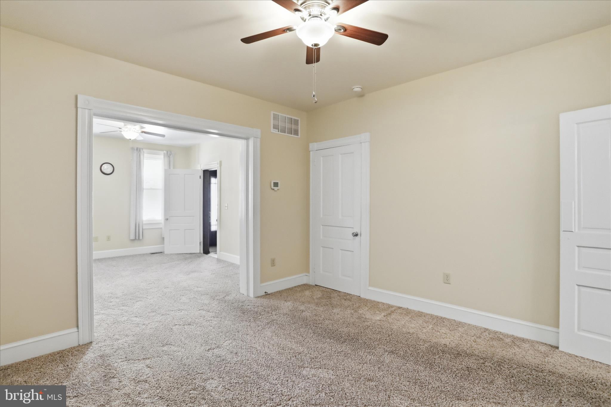 438 Chestnut Street Cumberland, MD 21502 - Photo 22 of 36 an empty room with fan and entrance