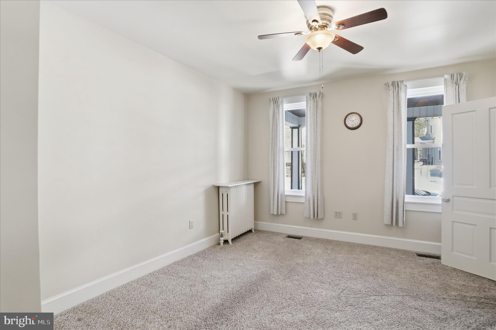 438 Chestnut Street Cumberland, MD 21502 - Photo 26 of 36 an empty room with windows and fan