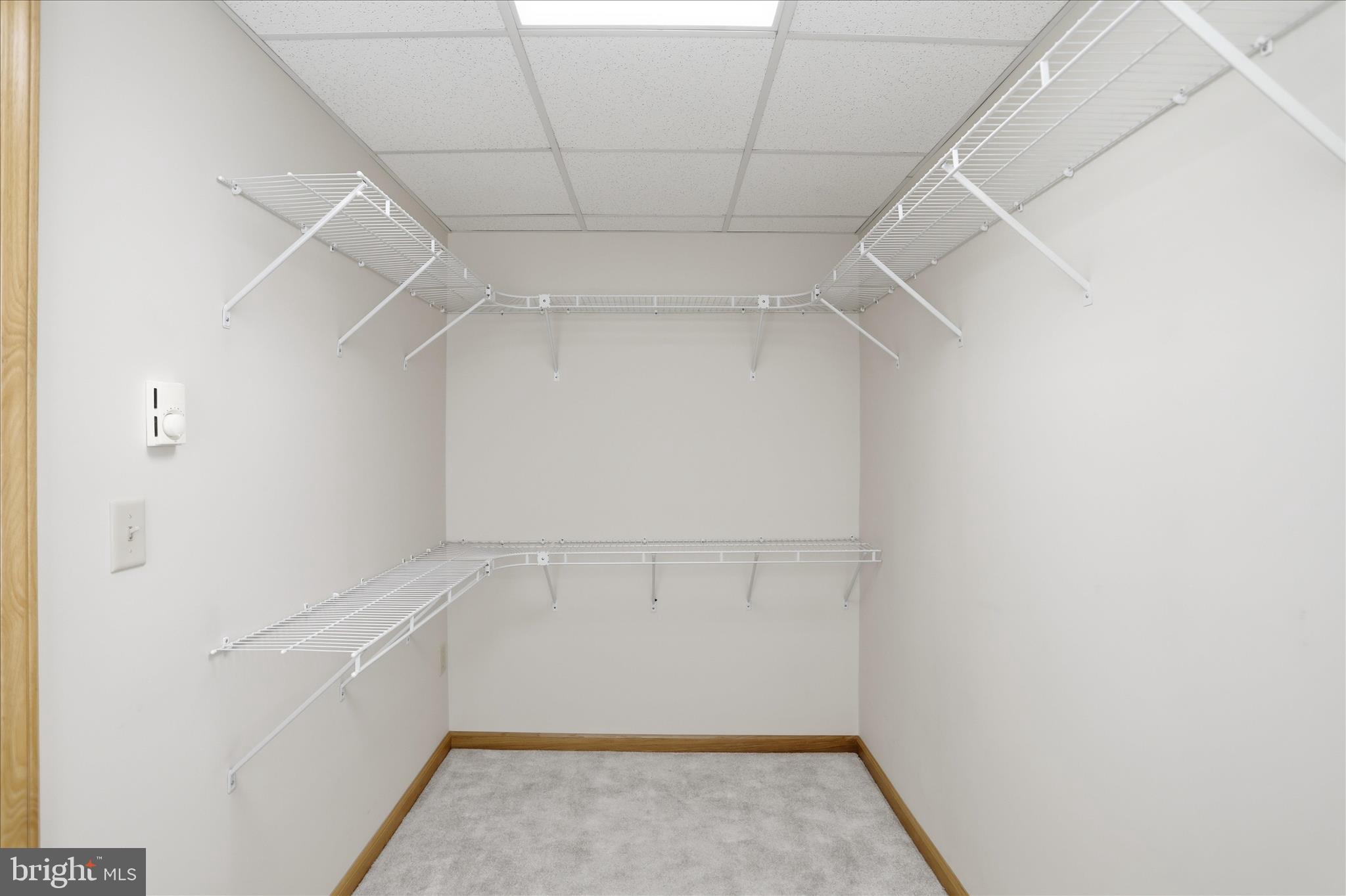438 Chestnut Street Cumberland, MD 21502 - Photo 10 of 36 a view of walk in closet with empty racks