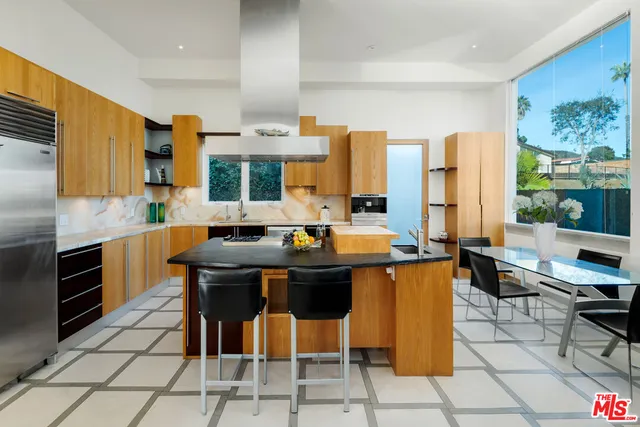 a kitchen with stainless steel appliances a sink and counter space
