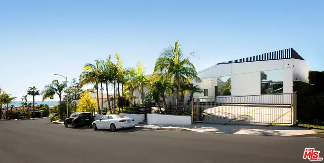 a view of a street with cars on road