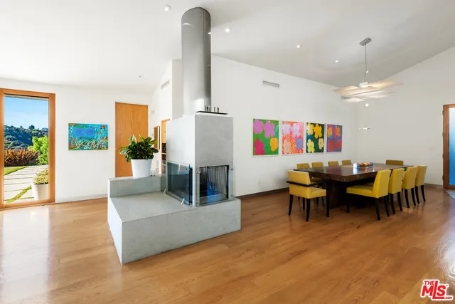 a living room with furniture a dining table and chairs