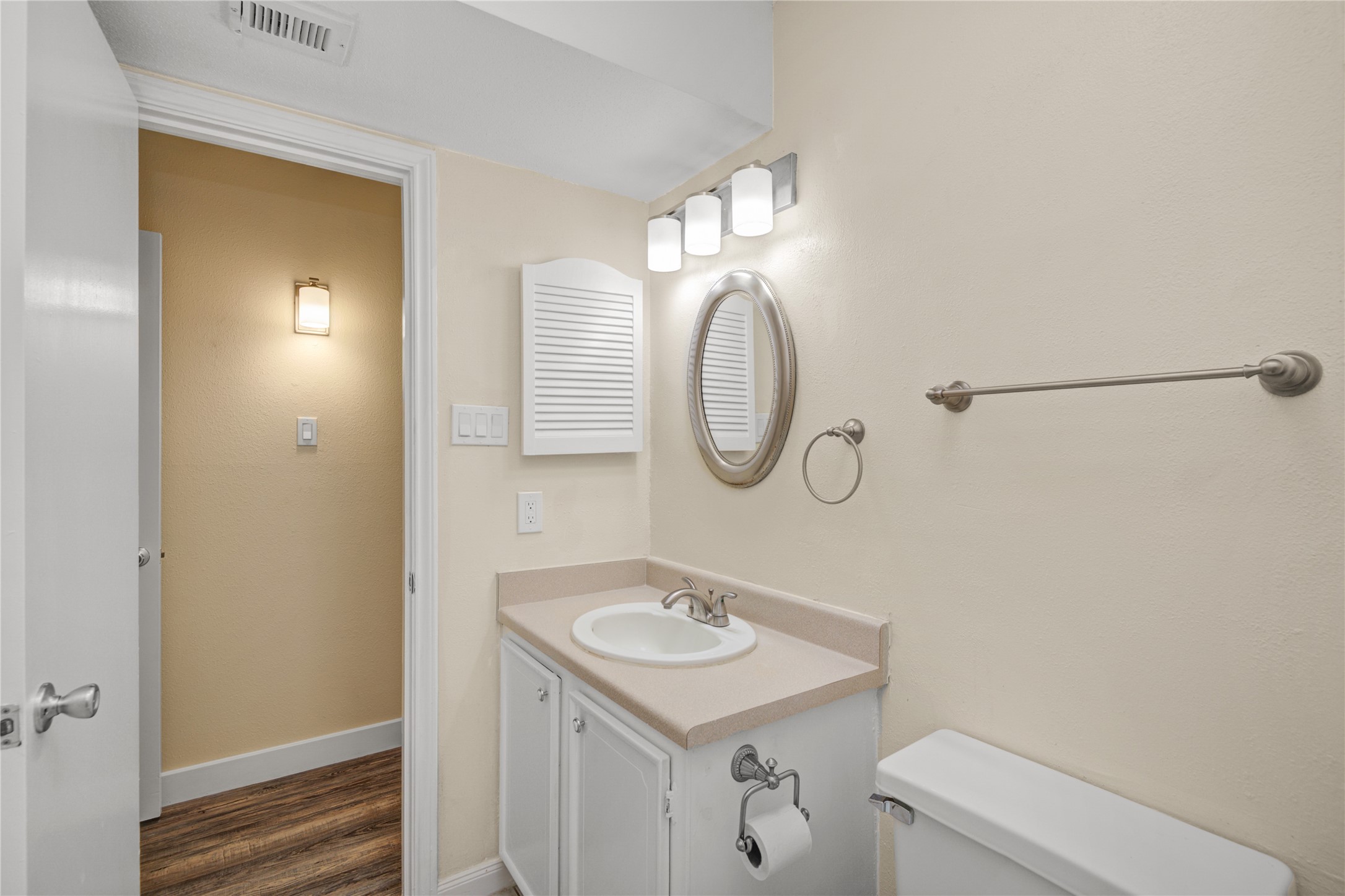 11540 Chimney Rock Road, Unit 117 Houston, TX 77035 - Photo 20 of 38 a bathroom with a sink a toilet and a mirror