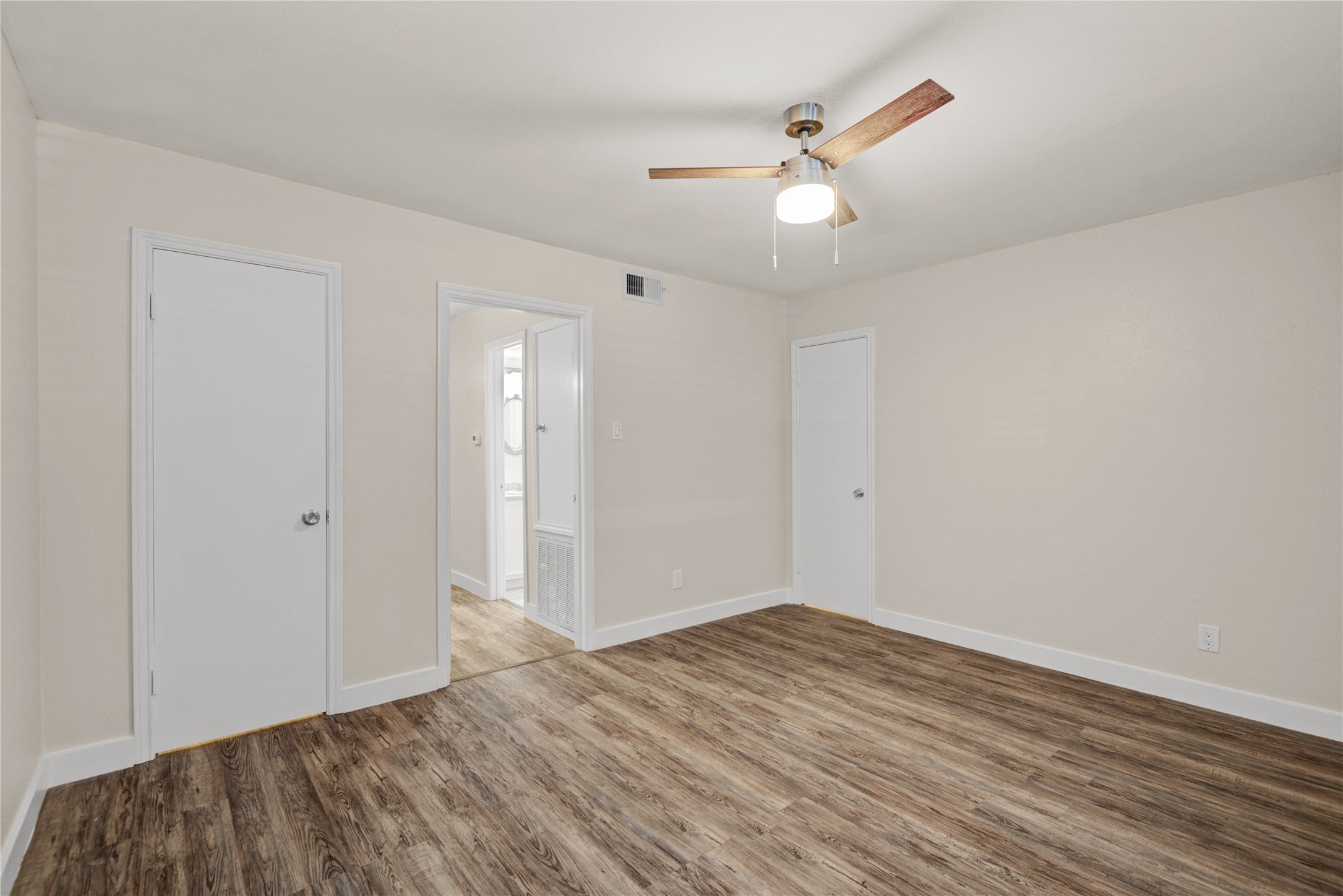 11540 Chimney Rock Road, Unit 117 Houston, TX 77035 - Photo 22 of 38 a view of an empty room with wooden floor