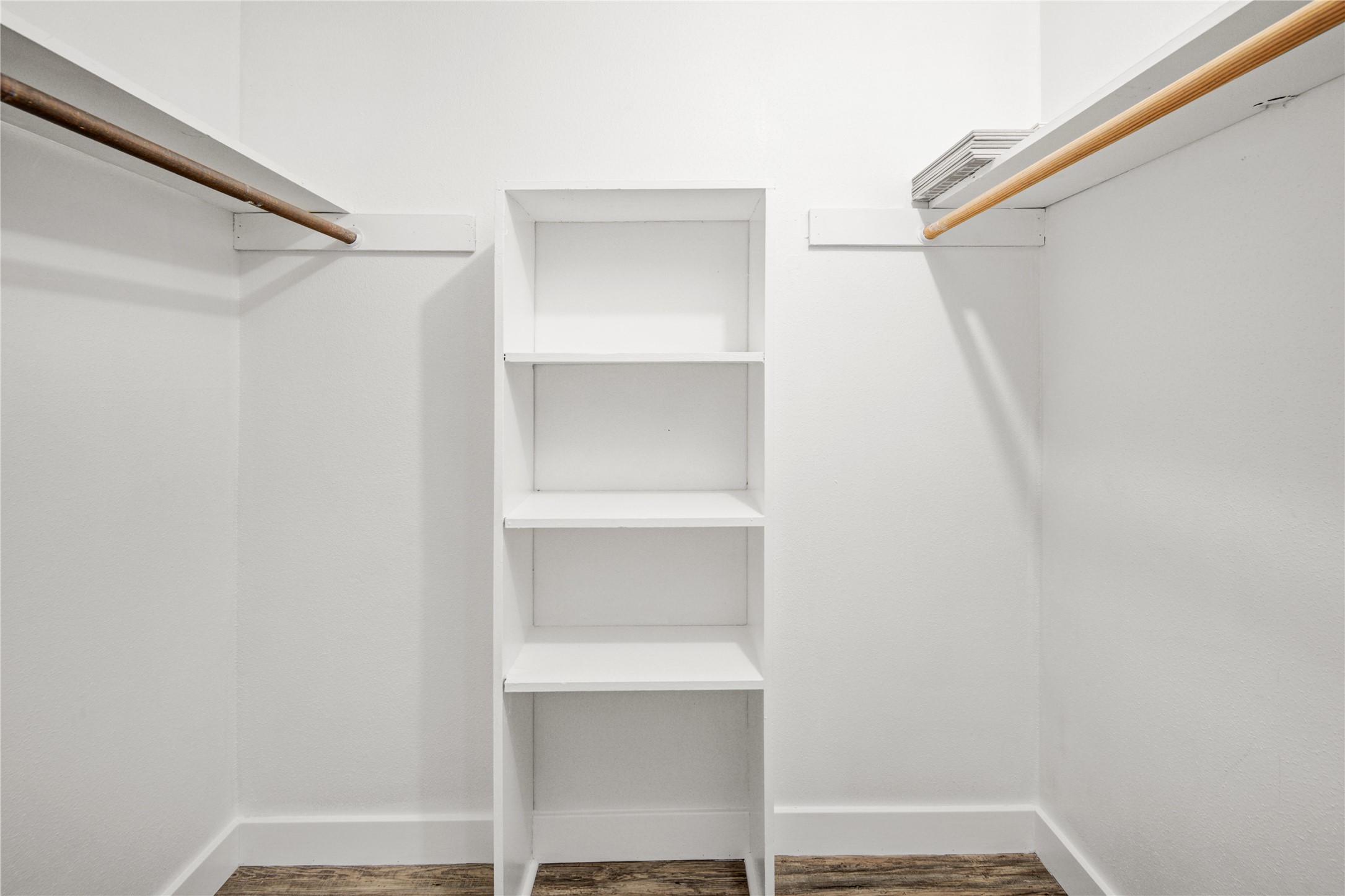 11540 Chimney Rock Road, Unit 117 Houston, TX 77035 - Photo 25 of 38 a view of walk in closet with empty racks
